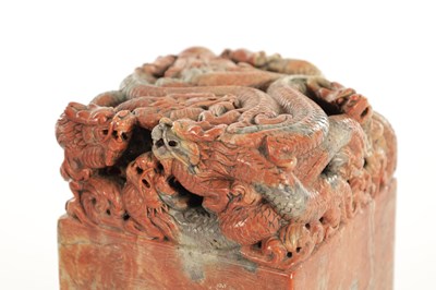 Lot 140 - A LARGE CHINESE CARVED ROUGE SOAPSTONE SEAL