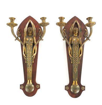 Lot 901 - A PAIR OF EARLY 20TH CENTURY BRONZE AND GILT BRONZE  REGENCY STYLE EGYPTIAN WALL DOUBLE BRANCH CANDELABRA