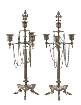 Lot 882 - A PAIR OF 19TH CENTURY REGENCY STYLE PATINATED BRASS CANDLESTICKS