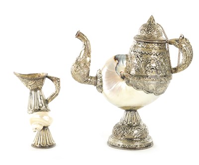 Lot 195 - AN EARLY 20TH CENTURY TIBETAN SILVER METAL AND MOTHER OF PEARL SHELL TEAPOT AND JUG