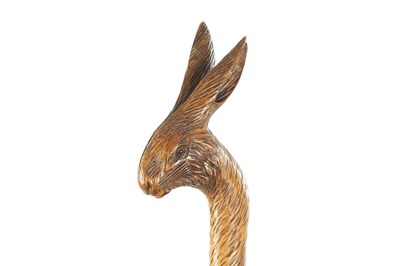 Lot 726 - A 19TH CENTURY CARVED LINDEN WOOD BLACK FOREST WALKING STICK MODELLED AS A HARE