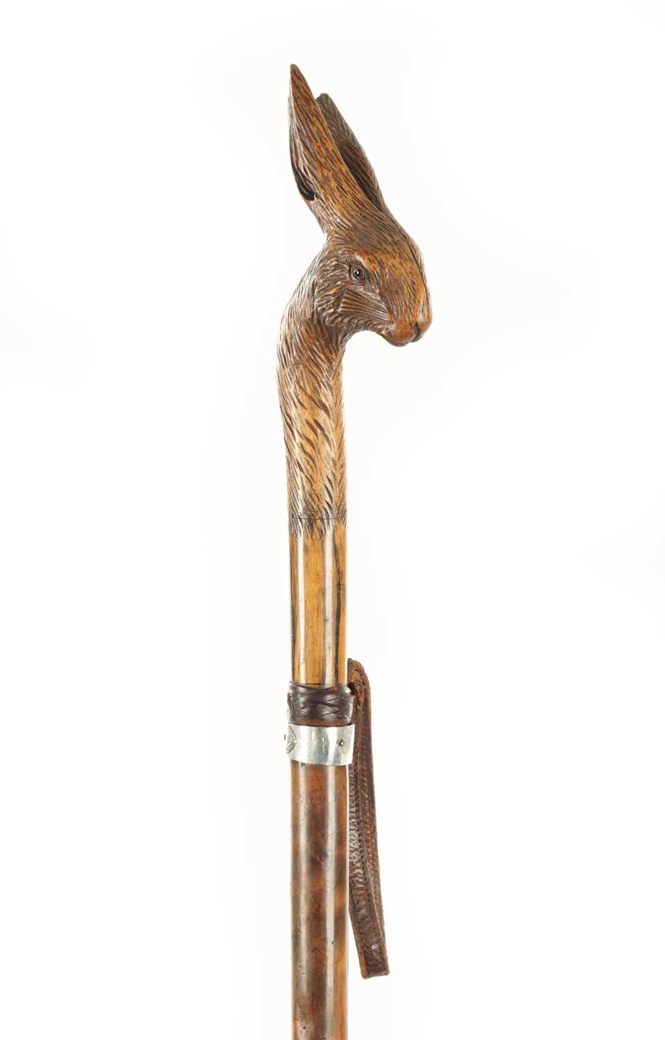 Lot 726 - A 19TH CENTURY CARVED LINDEN WOOD BLACK FOREST WALKING STICK MODELLED AS A HARE