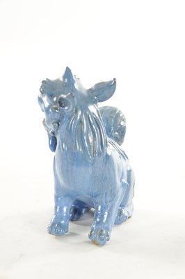 Lot 127 - A 19TH CENTURY CHINESE BLUE GLAZED SEATED FOO DOG