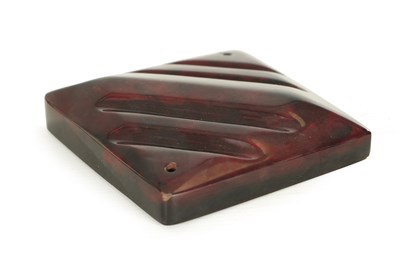 Lot 928 - AN ART DECO CHERRY AMBER 'STARDUST' BAKELITE PEN TRAY