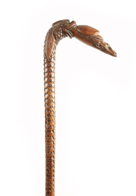 Lot 718 - A 19TH CENTURY CARVED FRUITWOOD FOLK ART WALKING STICK