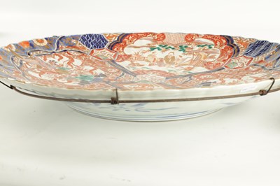 Lot 244 - A LARGE PAIR OF MEIJI PERIOD JAPANESE SCALLOP EDGE IMARI CHARGERS
