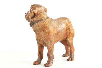 Lot 1352 - A 19TH CENTURY CARVED LINDEN WOOD BLACK FOREST SCULPTURE OF A DOG