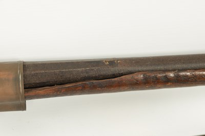 Lot 572 - AN EARLY 19TH CENTURY MATCHLOCK LONG BARRELLED GUN