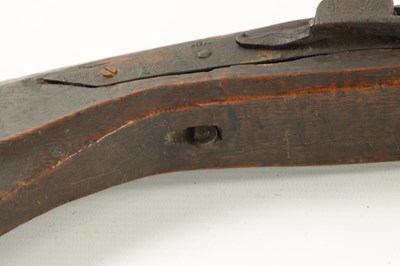 Lot 572 - AN EARLY 19TH CENTURY MATCHLOCK LONG BARRELLED GUN