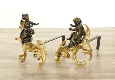 Lot 747 - A PAIR OF 19TH CENTURY ROCOCO STYLE GILT BRASS AND BRONZE CHENETS