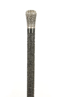 Lot 681 - A LATE 19TH CENTURY INDIAN CARVED EBONY AND SILVER TOPPED WALKING STICK