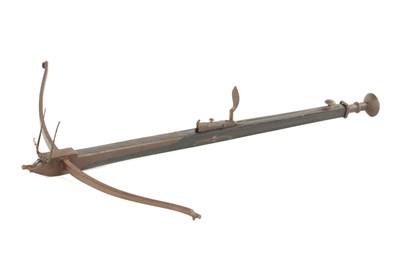 Lot 670 - AN EARLY 17TH CENTURY GERMAN WALNUT AND IRON CROSS-BOW