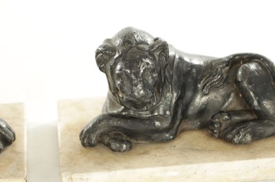 Lot 876 - A PAIR OF REGENCY PAINTED LEAD RECUMBENT LIONS IN THE MANNER OF THOMAS HOPE