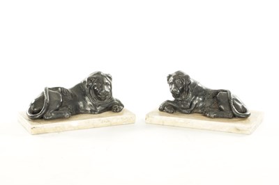 Lot 876 - A PAIR OF REGENCY PAINTED LEAD RECUMBENT LIONS IN THE MANNER OF THOMAS HOPE