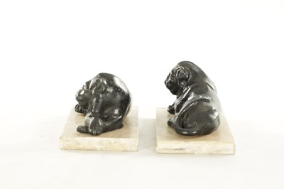 Lot 876 - A PAIR OF REGENCY PAINTED LEAD RECUMBENT LIONS IN THE MANNER OF THOMAS HOPE