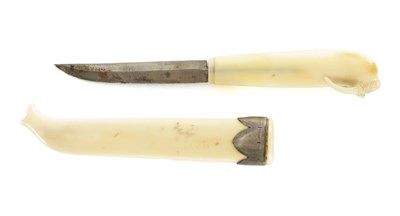 Lot 618 - A RARE 19TH CENTURY CARVED WALRUS TOOTH KNIFE