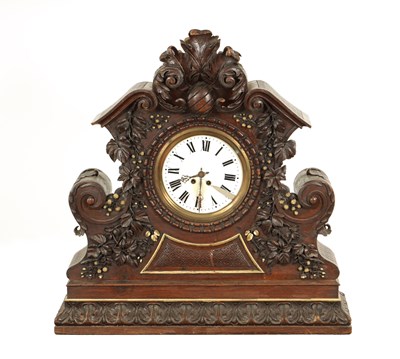 Lot 1189 - A MASSIVE 19TH CENTURY CARVED WALNUT BLACK FOREST MANTEL CLOCK