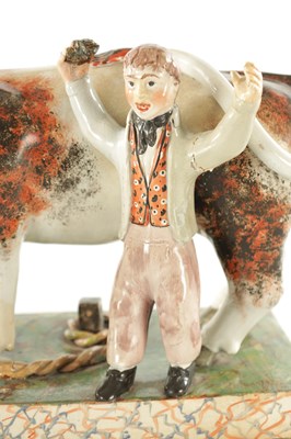 Lot 266 - A 19TH CENTURY STAFFORDSHIRE BULL BAITING GROUP