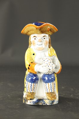 Lot 368 - AN EARLY 19TH CENTURY STAFFORDSHIRE PRATT WARE TOBY JUG AND COVER