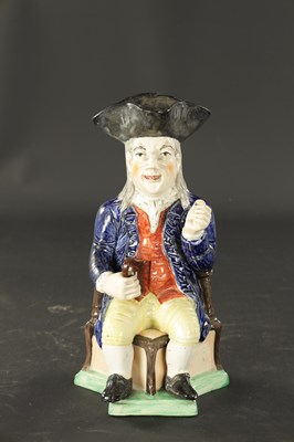 Lot 232 - A LATE 19TH CENTURY COPY OF A STAFFORDSHIRE SQUIRE TOBY JUG