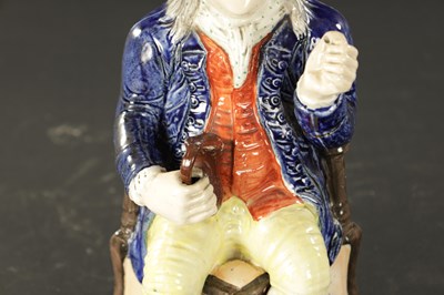 Lot 232 - A LATE 19TH CENTURY COPY OF A STAFFORDSHIRE SQUIRE TOBY JUG