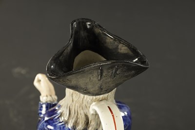 Lot 232 - A LATE 19TH CENTURY COPY OF A STAFFORDSHIRE SQUIRE TOBY JUG