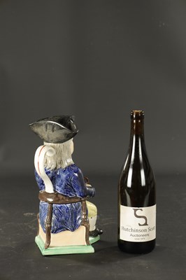 Lot 232 - A LATE 19TH CENTURY COPY OF A STAFFORDSHIRE SQUIRE TOBY JUG