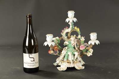 Lot 376 - A 19TH CENTURY MEISSEN THREE BRANCH FIGURAL CANDELABRA