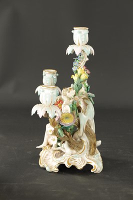 Lot 376 - A 19TH CENTURY MEISSEN THREE BRANCH FIGURAL CANDELABRA
