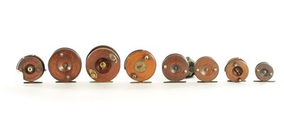 Lot 656 - A COLLECTION OF EIGHT VINTAGE WOOD AND BRASS FLY FISHING REELS