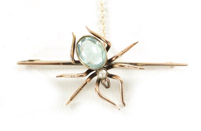 Lot 470 - A 9CT ROSE GOLD AND AQUAMARINE SPIDER BAR BROOCH