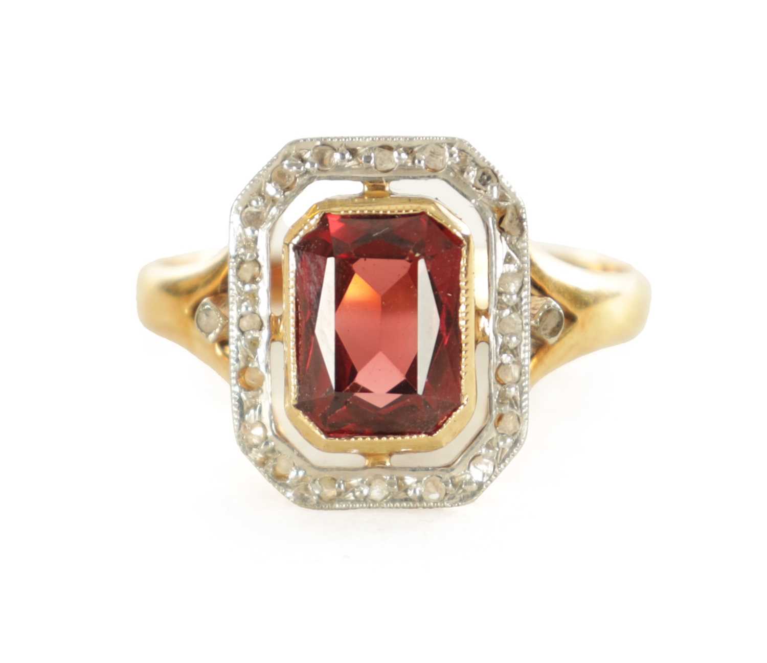 Lot 489 - A LADIES FRENCH 18CT GOLD GARNET AND DIAMOND RING