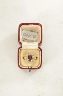 Lot 489 - A LADIES FRENCH 18CT GOLD GARNET AND DIAMOND RING