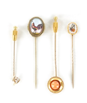 Lot 483 - A COLLECTION OF FOUR 9CT GOLD AND GILT METAL STICK PINS