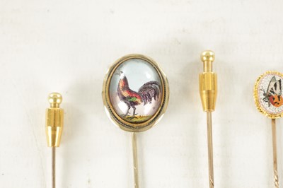 Lot 483 - A COLLECTION OF FOUR 9CT GOLD AND GILT METAL STICK PINS