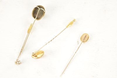 Lot 483 - A COLLECTION OF FOUR 9CT GOLD AND GILT METAL STICK PINS