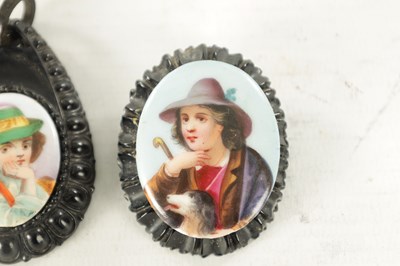 Lot 480 - A VICTORIAN CARVED JET AND PORCELAIN MINIATURE BROOCH AND PENDANT