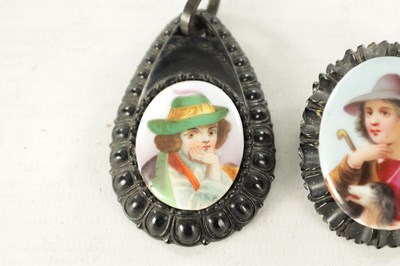 Lot 480 - A VICTORIAN CARVED JET AND PORCELAIN MINIATURE BROOCH AND PENDANT