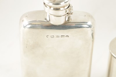 Lot 395 - A VICTORIAN SILVER HIP FLASK AND AN EDWARDIAN SILVER TEA CADDY