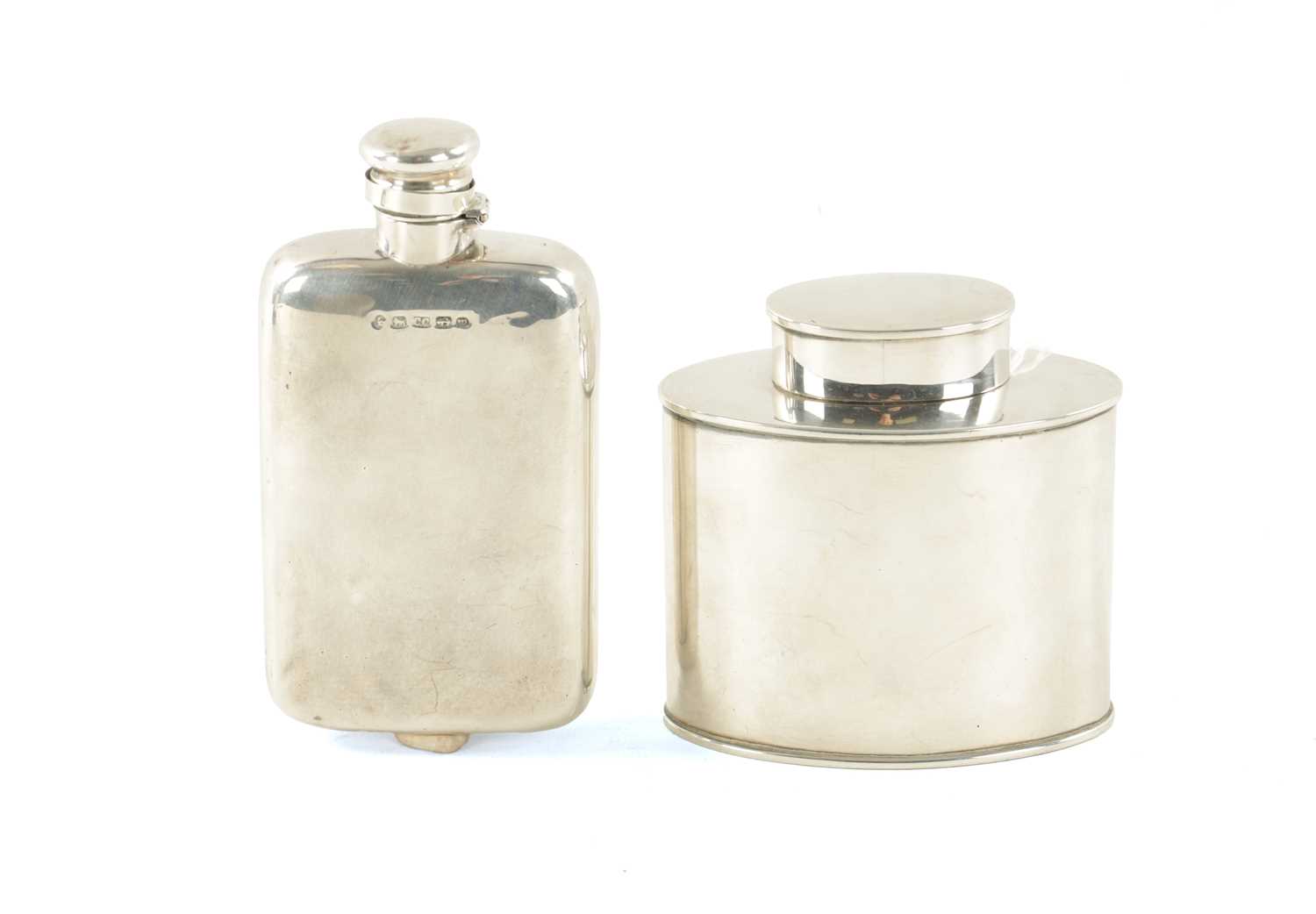 Lot 395 - A VICTORIAN SILVER HIP FLASK AND AN EDWARDIAN SILVER TEA CADDY