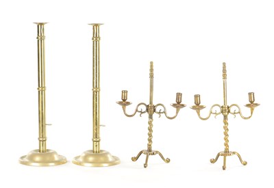 Lot 566 - A PAIR OF 18TH CENTURY CAST BRASS ADJUSTABLE CANDLELIGHTS TOGETHER WITH A LARGE PAIR OF 19TH CENTURY BRASS PUSH EJECTOR CANDLESTICKS