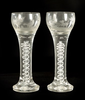 Lot 5 - A PAIR OF OVERSIZED EARLY 20TH CENTURY AIR TWIST AND ETCHED WINE GLASSES