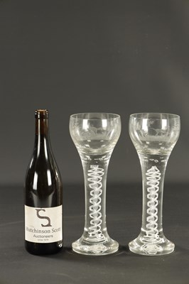 Lot 5 - A PAIR OF OVERSIZED EARLY 20TH CENTURY AIR TWIST AND ETCHED WINE GLASSES