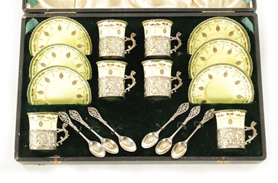 Lot 254 - A CASED ROYAL WORCESTER SIX PIECE COFFEE SERVICE WITH SILVER PLATED CUPHOLDERS AND SPOONS