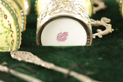 Lot 254 - A CASED ROYAL WORCESTER SIX PIECE COFFEE SERVICE WITH SILVER PLATED CUPHOLDERS AND SPOONS