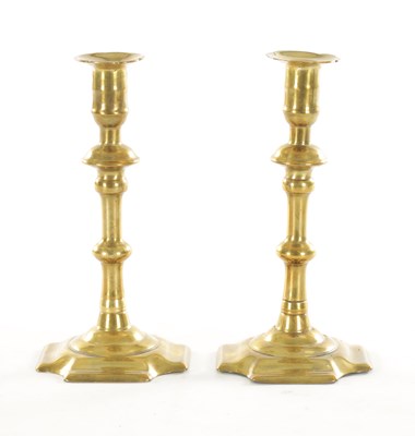 Lot 552 - A RARE PAIR OF EARLY 18TH CENTURY “GEORGE GROVE” TWIST EJECTOR STEM SQUARE BASE SEAMED BRASS CANDLESTICKS