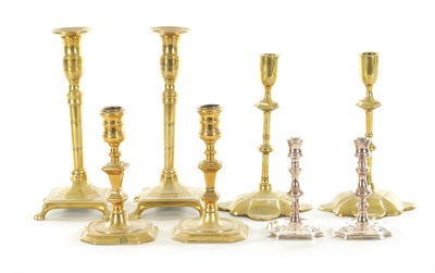 Lot 561 - A COLLECTION OF FOUR PAIRS OF 18TH CENTURY STYLE CAST BRASS CANDLESTICKS