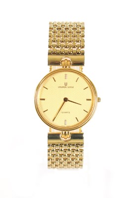 Lot 509 - A VINTAGE GOLD PLATED UNIVERSAL-GENEVE WRISTWATCH