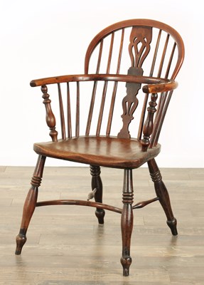 Lot 855 - A 19TH CENTURY LOW BACK YEW-WOOD WINDSOR CHAIR