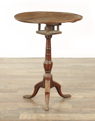 Lot 823 - A GEORGE III OAK CIRCULAR TILT TOP TRIPOD TBALE